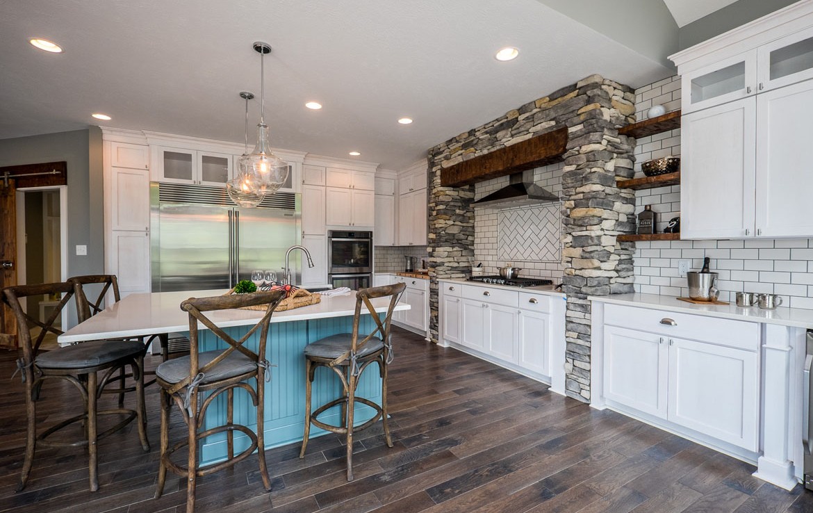 aspen luxury home kitchen custom stone work white cabinets– Infinity Custom Homes