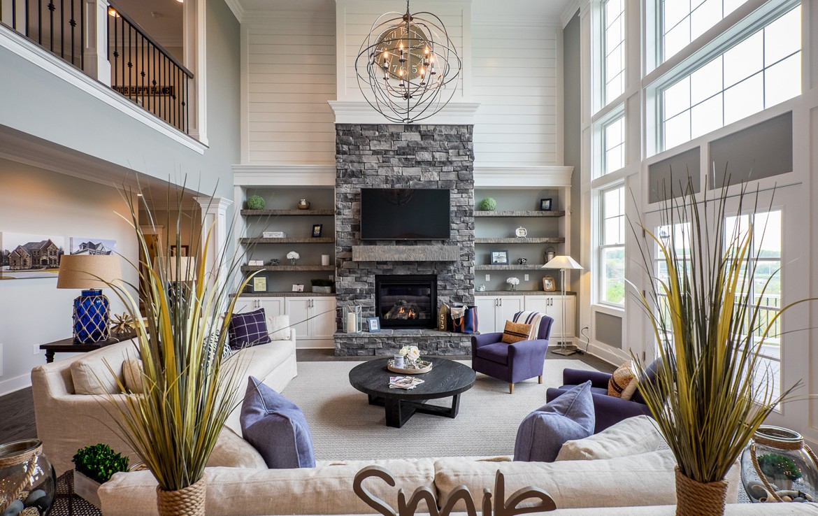 cambridge luxury home cozy living room with stone fireplace – Infinity Custom Homes