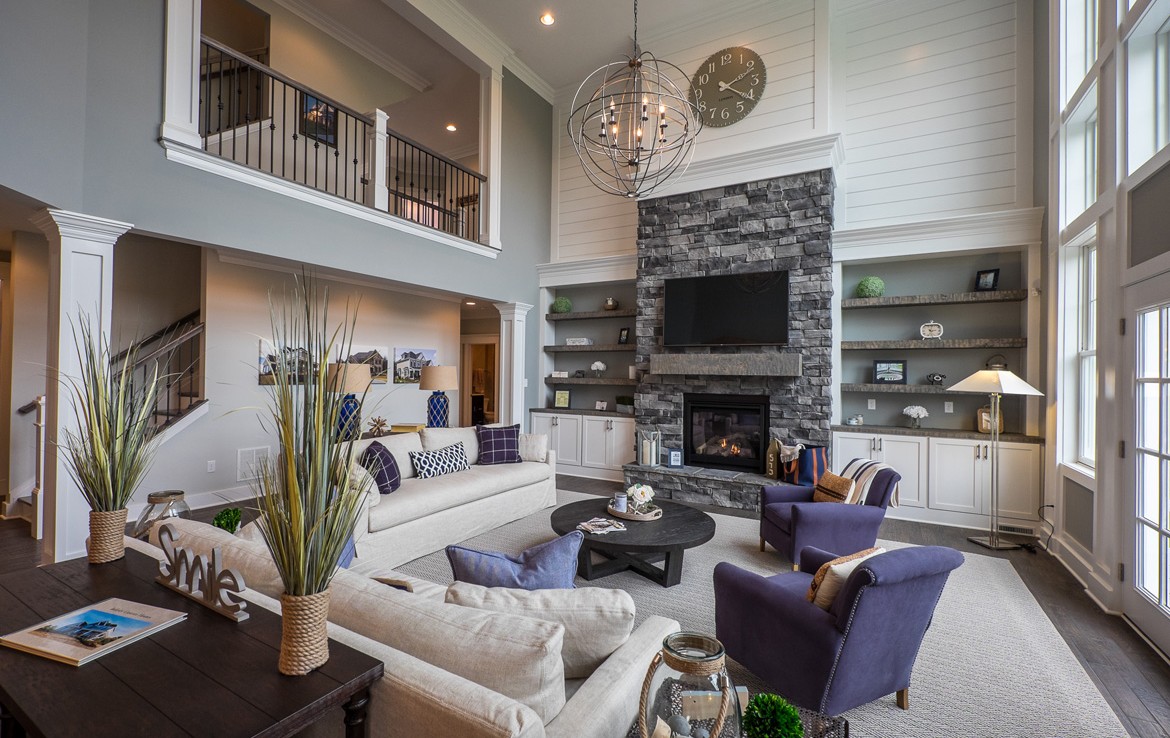 cambridge luxury home cozy living room with stone fireplace – Infinity Custom Homes