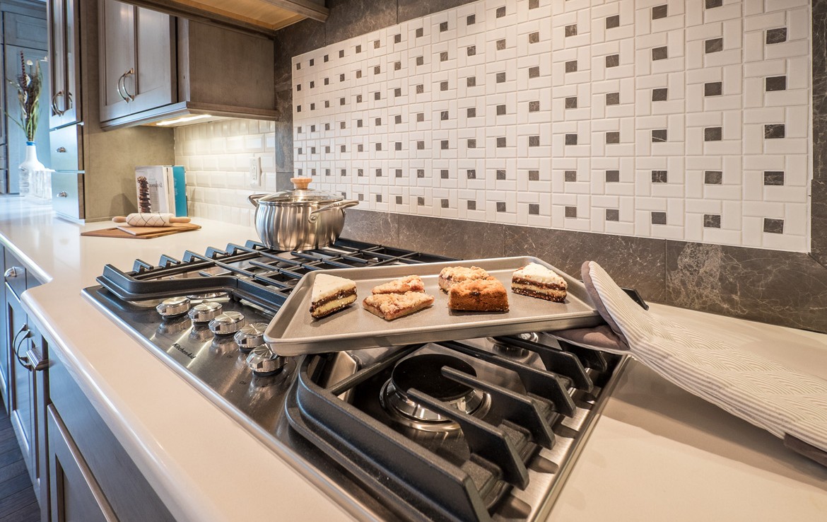 cambridge luxury home country style kitchen with white tile backsplash – Infinity Custom Homes