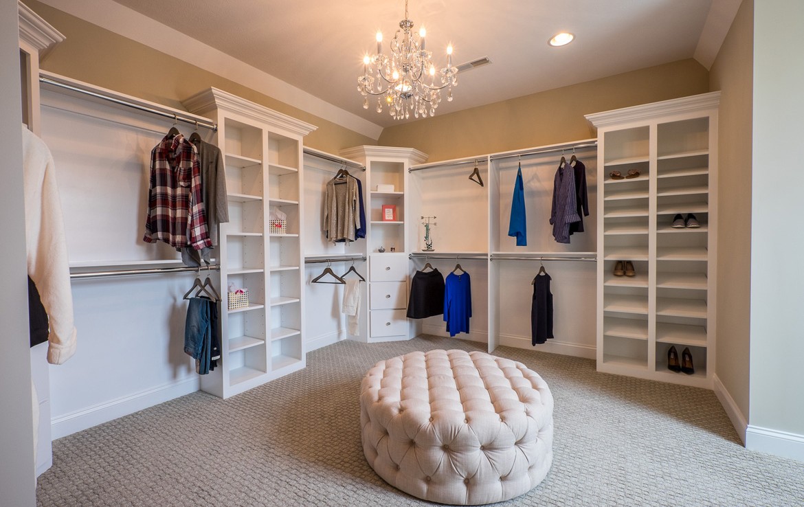 cambridge luxury home walk-in closet with white builtins – Infinity Custom Homes