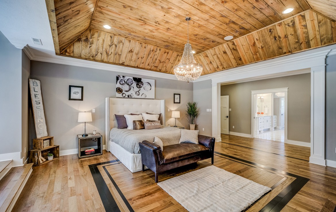 austin luxury home master suite with custom woodwork and fireplace – Infinity Custom Homes