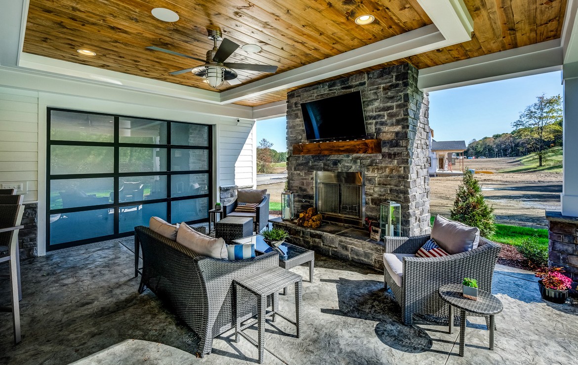 austin luxury home outdoor fireplace and siting area – Infinity Custom Homes