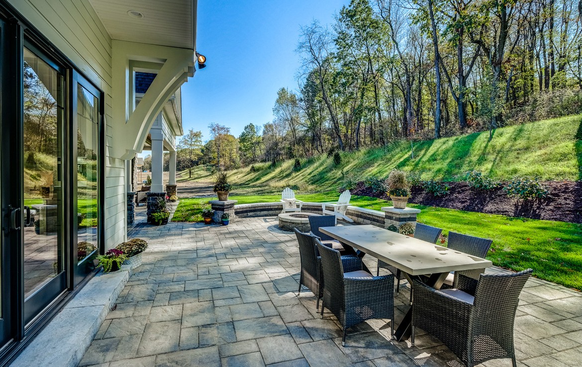 austin luxury home outdoor patio with firepit– Infinity Custom Homes