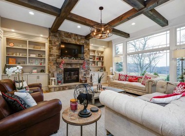 Country style living room with builtins and stone fireplace – Austin Model Home