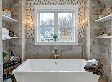 Tub, stone walls – Stone Shower – Austin Forest Edge Model Home