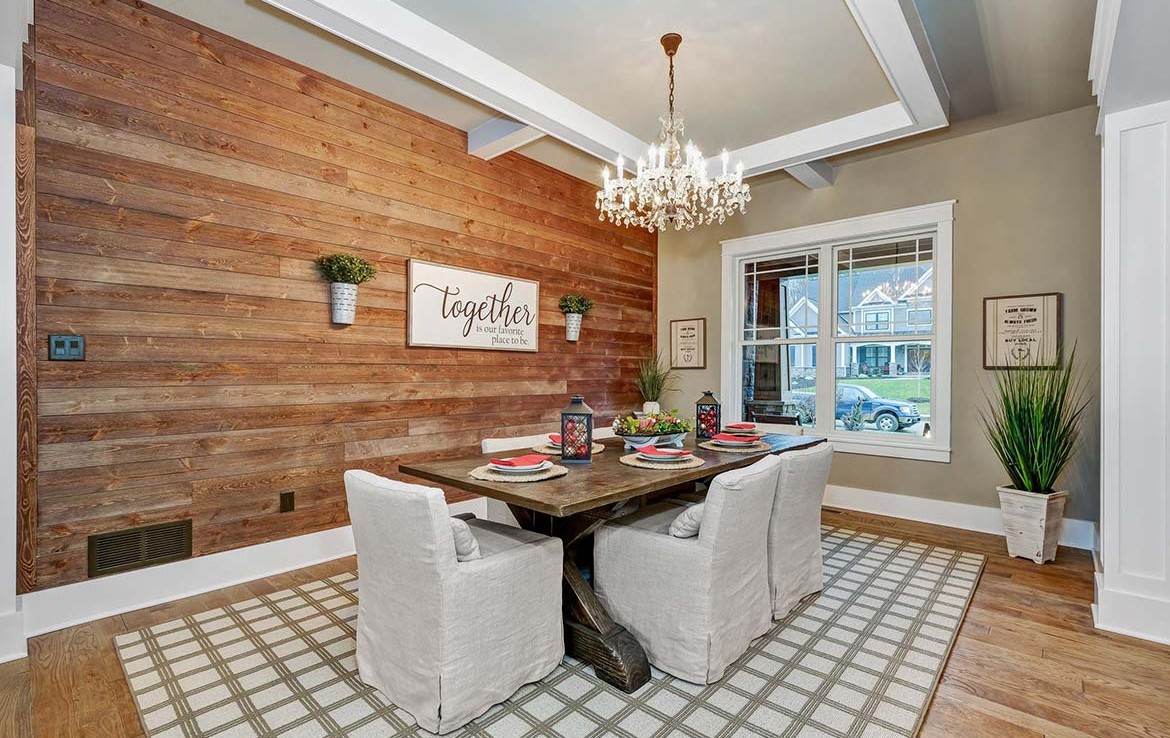 Austin Model Home at Forest Edge, Cranberry, PA, dining with farm table and shiplap wall – Infinity Custom Homes