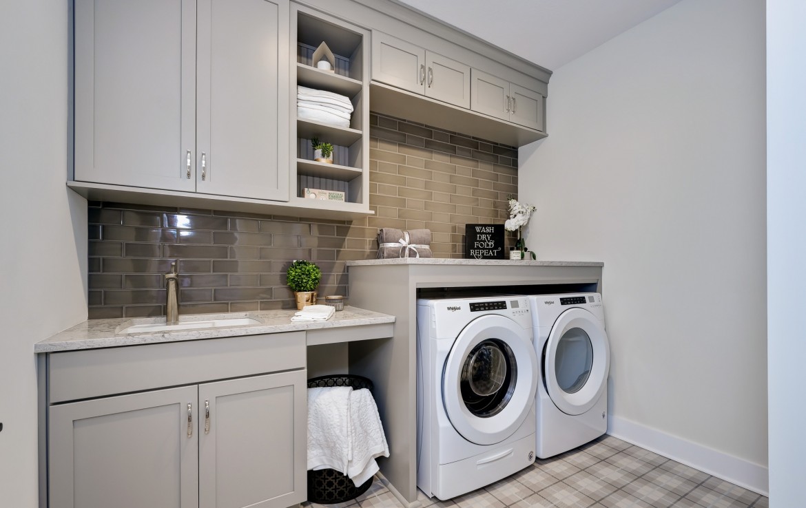 Nantucket Model Home, tudor style luxury home, laundry room – Infinity Custom Homes