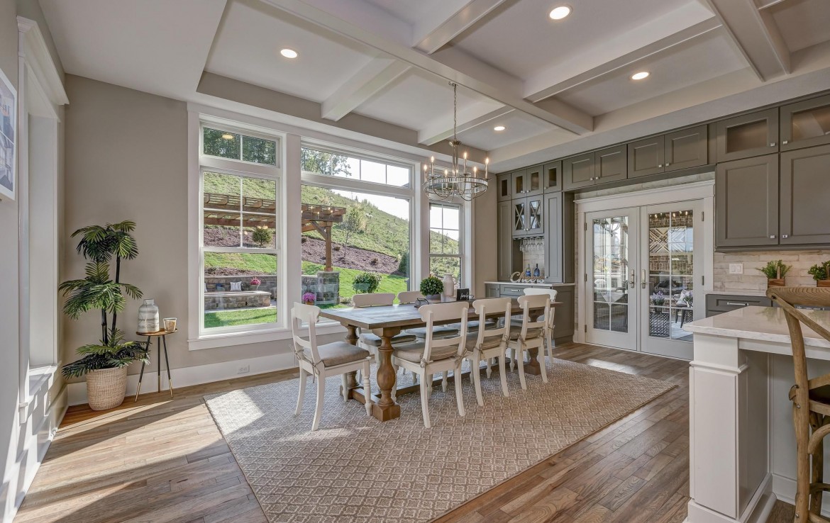 Nantucket Model Home, tudor style luxury home, farmstyle dining room – Infinity Custom Homes