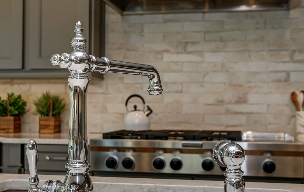 Nantucket Model Home, tudor style luxury home, kitchen island detail – Infinity Custom Homes