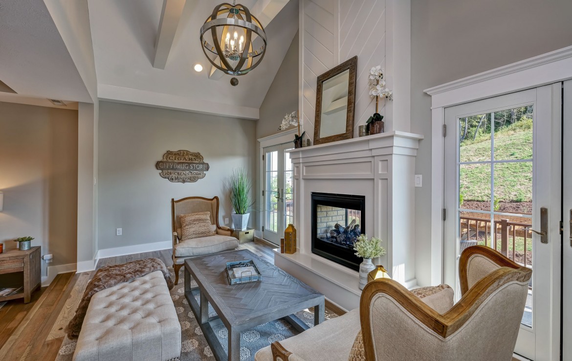 Nantucket Model Home, tudor style luxury home, master bedroom fireplace – Infinity Custom Homes
