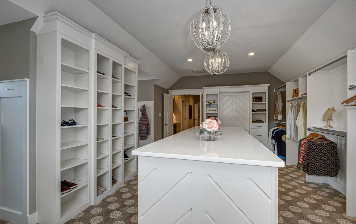 Nantucket Model Home, tudor style luxury home, master bedroom closet builtins – Infinity Custom Homes