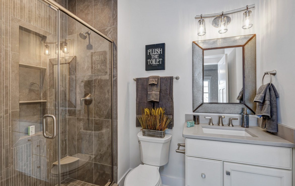 Nantucket Model Home, tudor style luxury home, kids bathroom – Infinity Custom Homes