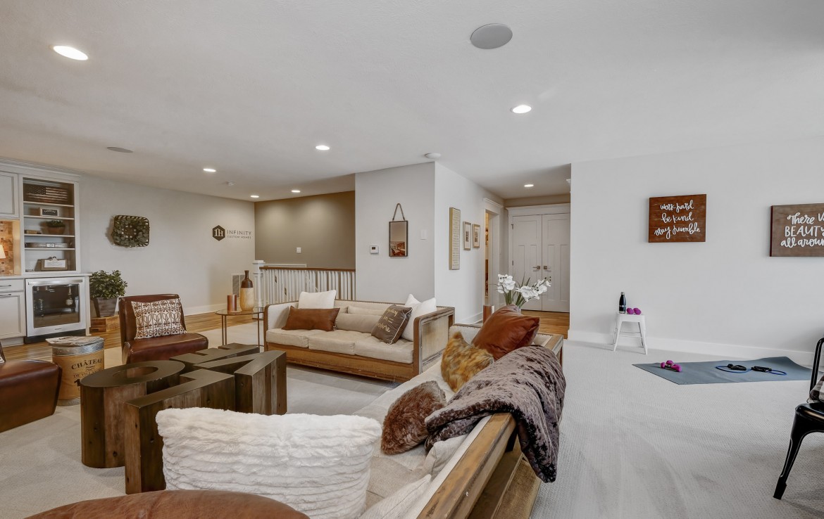 Nantucket Model Home, tudor style luxury home, family room – Infinity Custom Homes