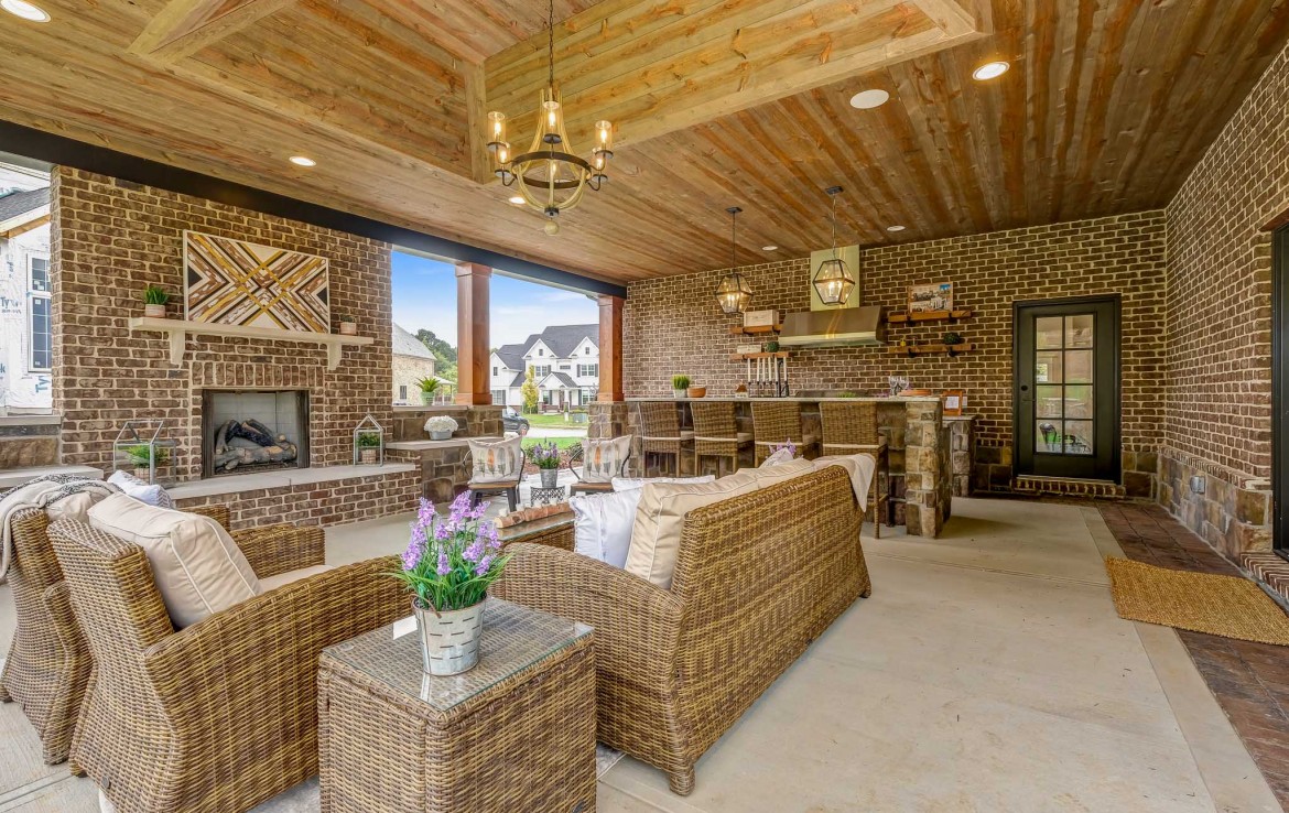 Nantucket Model Home, tudor style luxury home, exterior patio – Infinity Custom Homes
