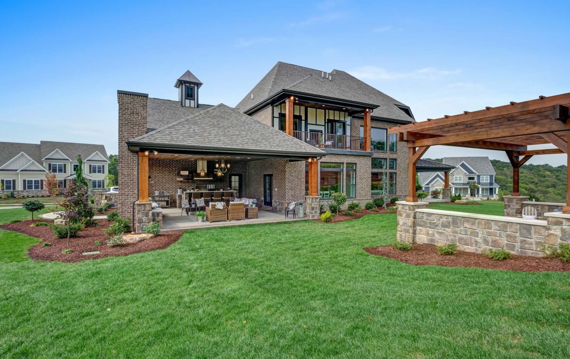 Nantucket Model Home, tudor style luxury home, exterior patio outdoor – Infinity Custom Homes