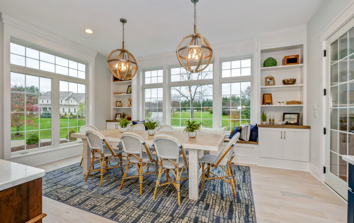 Portland Model Home, beach style luxury home in Mars PA, kitchen dining area with white builtins – Infinity Custom Homes