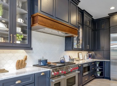 Portland Model Home, beach style luxury home in Mars PA, kitchen with dark blue cabinets with bronze hardware – Infinity Custom Homes