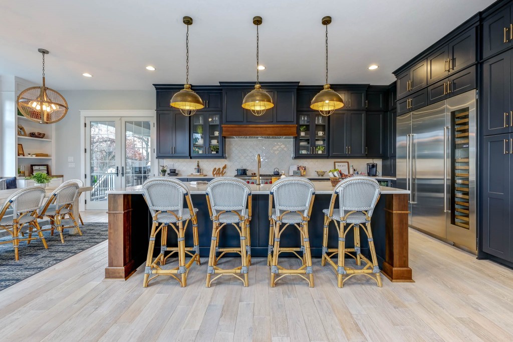 Portland Model Home, beach style luxury home in Mars PA, kitchen with dark blue cabinets with bronze hardware – Infinity Custom Homes