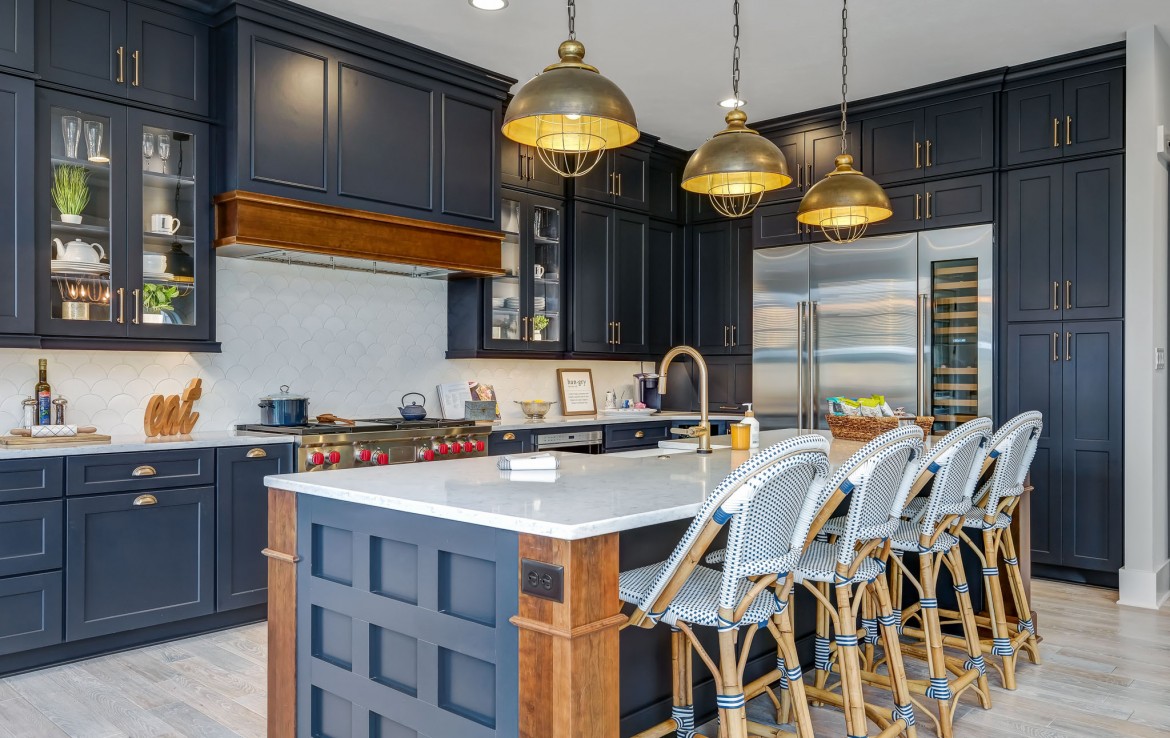 Portland Model Home, beach style luxury home in Mars PA, kitchen with dark blue cabinets with bronze hardware – Infinity Custom Homes