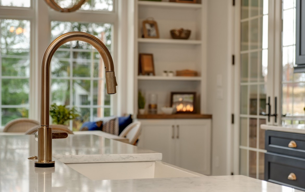Portland Model Home, beach style luxury home in Mars PA, bronze island faucet detail – Infinity Custom Homes