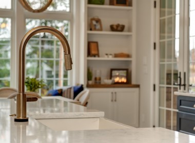 Portland Model Home, beach style luxury home in Mars PA, bronze island faucet detail – Infinity Custom Homes