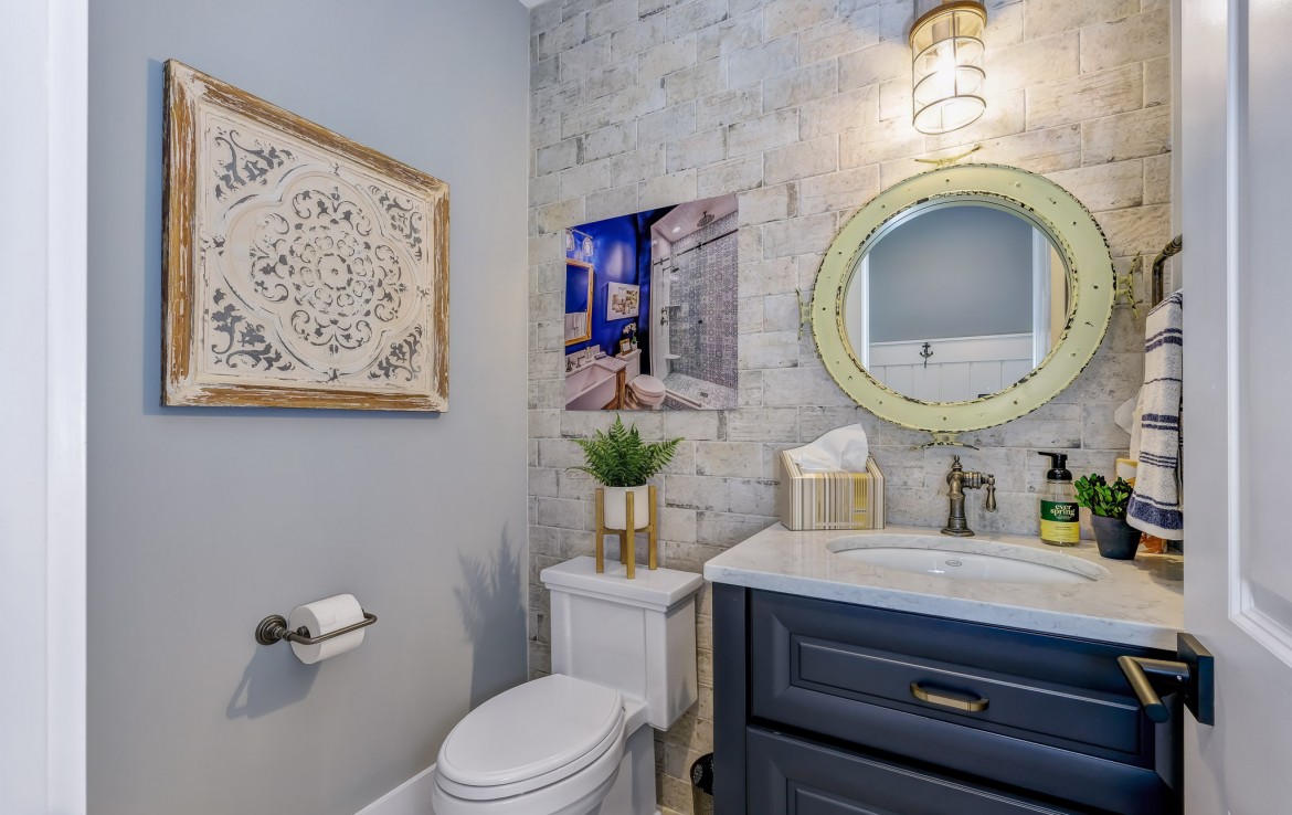 Portland Model Home, beach style luxury home in Mars PA, bathroom with dark blue vanity – Infinity Custom Homes