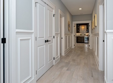 Portland Model Home, beach style luxury home in Mars PA, hallway white trim – Infinity Custom Homes